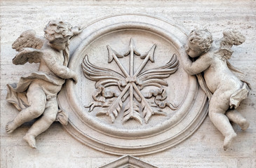 Angels with symbols of martyrdom on the portal of Sant Andrea della Valle Church in Rome, Italy 