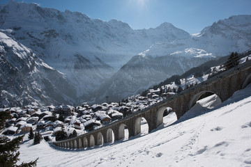 Winter wonderland on a beautiful sunny day in the swiss alps, above the mountain village  murren.