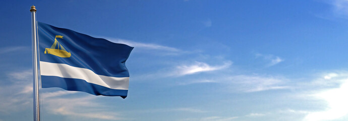 Flag of Tyumen Oblast rise waving to the wind with sky in the background