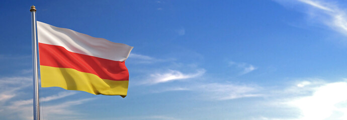 Flag of South Ossetia rise waving to the wind with sky in the background