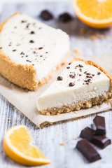 cheesecake with lemon orange and chocolate on white background