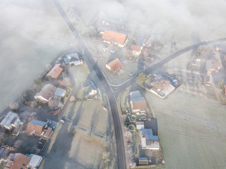 Aerial view of buildings under fog in Switzerland