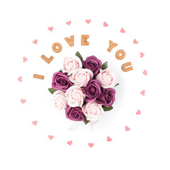 Valentine's day concept. Declaration of love, frame made of paper hearts. In the center flowers in a box. Flat lay, top view, white background, isolated, copy space