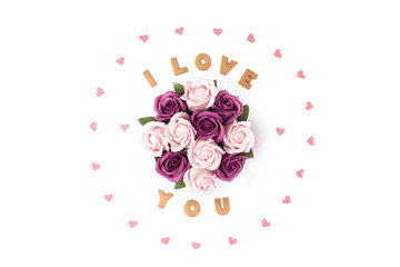 Valentine's day concept. Declaration of love, frame made of paper hearts. In the center flowers in a box. Flat lay, top view, white background, isolated, copy space