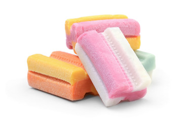 Heap of multicolored chewing gum isolated on white