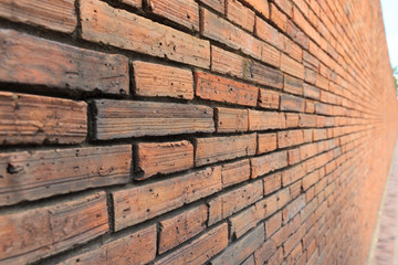 The background of textured brick wall. The walls of the house