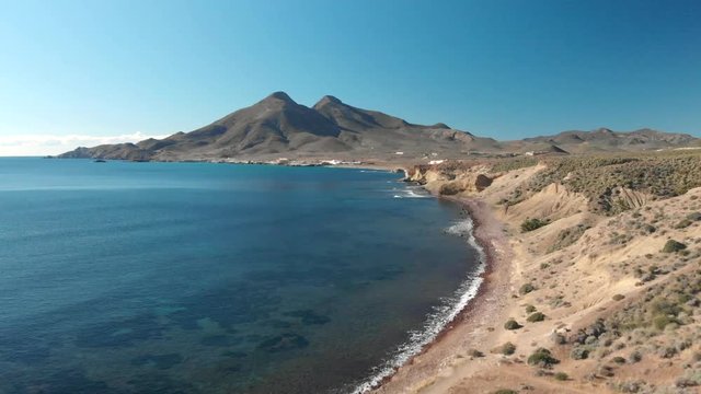 Aerial video of the waves on the beach at sunset. Amazing view of the MEDITERRANEAN coast in CABO DE GATA,SPAIN