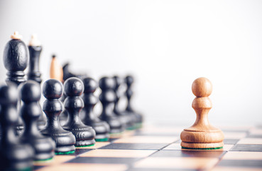 Chess board with wooden chess pieces on the table