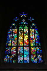 Beautiful colorful old gothic stained glass window in St. Vitus cathedral, Prague, Czech Republic