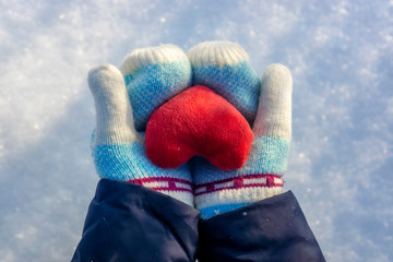 Plush love heart in hands in Valentine's day