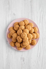 Almond cookies on pink plate, top view. Flat lay, overhead, from above.