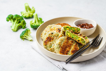 Green Veggie broccoli Cutlets in white dish on white background.