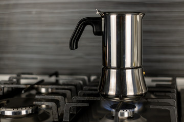 Geyser coffee maker from aluminum on the stove