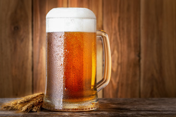 mug of beer on wooden table