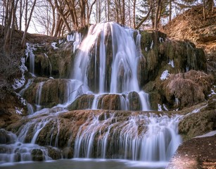 Fototapeta premium Beautiful big waterfall with snow