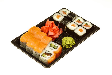 Sushi Rolls Set, maki, california rolls, on black plate and on white background.