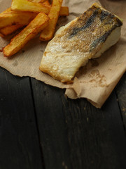 Fish and Fries (white fish with salmon, portion). food background. copy space