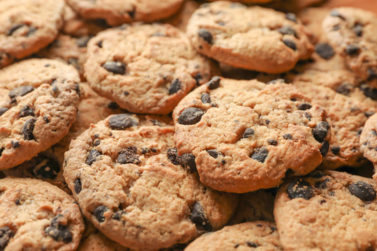 Tasty chocolate chip cookies as background