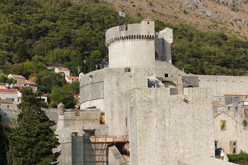 DUBROVNIK, CROATIA - AUGUST 22 2017: Dubrovnik ancient town walls, surrounded by houses