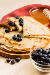 Fresh homemade crepes with blueberry and honey