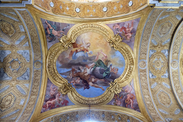 Fototapeta na wymiar The fresco of virtues of Hope and Truth on the little cupola of side nave in Basilica dei Santi Ambrogio e Carlo al Corso by Pio Paolini from (1678 - 81), Rome, Italy