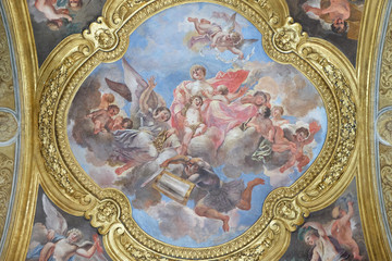 The fresco of virtue Charity on the little cupola of side nave in Basilica dei Santi Ambrogio e Carlo al Corso by Pio Paolini from (1678 - 81), Rome, Italy 