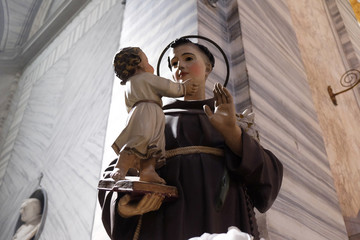 Saint Anthony of Padua holding baby Jesus statue in Basilica dei Santi Ambrogio e Carlo al Corso,...