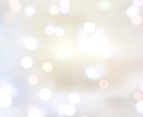 Obraz premium Blurred lights bokeh on soft beige background.