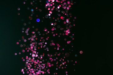 abstract bright colorful violet and red bokeh glitter sparkle blurred background. like molecule spread and absorb.