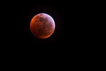 A super blood wolf moon glows orange over Wyoming