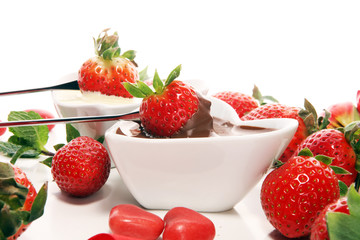 Valentine Chocolate fondue melted with fresh strawberries and dark and white chocolate. Tublips and sugar hearts.