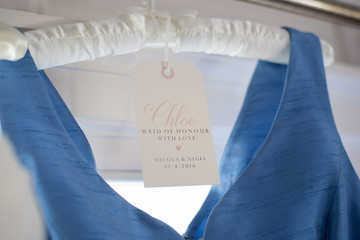 Bridesmaid dress hanging up before the ceremony