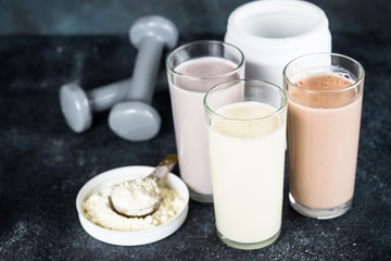 Protein cocktails and dumbbells, sport and fitness concept. 