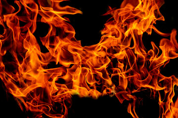Fototapeta premium Fire flames on abstract art black background texture