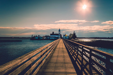 Fototapeta premium Wooden deck leading to the Saint Nikolas monastery in Porto Lagos. Xanthi Greece 