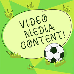 Conceptual hand writing showing Video Media Content. Business photo showcasing images and audio used to communicate brand message Soccer Ball on the Grass and Blank Round Color Shape photo