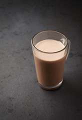 Chocolate Protein Shake. Nutrition for bodybuilding. Black stone background. Copy space.