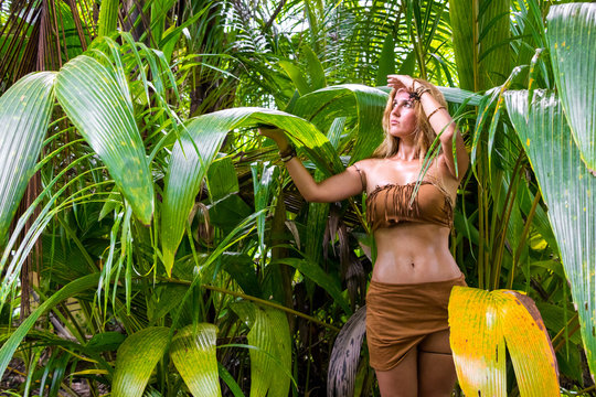Wild woman hidden in the green jungle