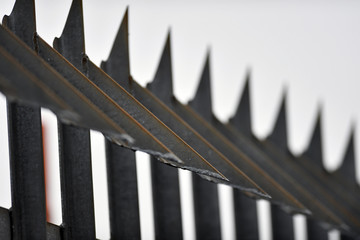 Fototapeta premium Partial view of an industrial high security metal fence.