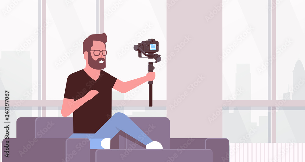 Poster man blogger broadcasting live stream shooting selfie video guy in front of dsrl camera recording him