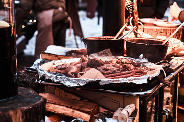 Outdoors kitchen, street food in a winter fair at Christmas time.