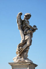 Fototapeta na wymiar Statue of Angel with the Crown of Thorns by Gian Lorenzo Bernini, Ponte Sant Angelo in Rome, Italy 