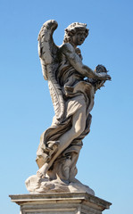 Fototapeta na wymiar Statue of Angel with the Crown of Thorns by Gian Lorenzo Bernini, Ponte Sant Angelo in Rome, Italy 