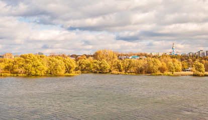 Autumn city on the banks of the river