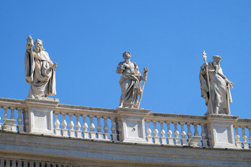 St. Romuald, Joseph and Peter Nolasco, fragment of colonnade of St. Peters Basilica. Papal Basilica...