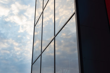 Modern building with glass walls with a sky in the background