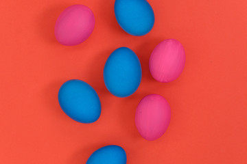 Colored eggs on a bright background. Top view with copy space.