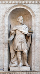 Fototapeta na wymiar Statue of Charles the Great on the facade of Chiesa di San Luigi dei Francesi - Church of St Louis of the French, Rome, Italy 