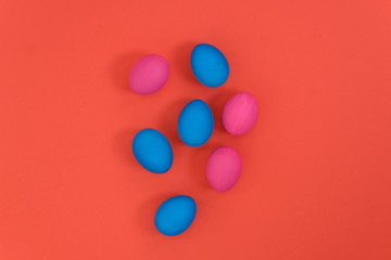 Colored eggs on a bright background. Top view with copy space.