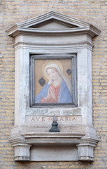 Image of Virgin Mary on the facade of a palace in Rome, Italy 
